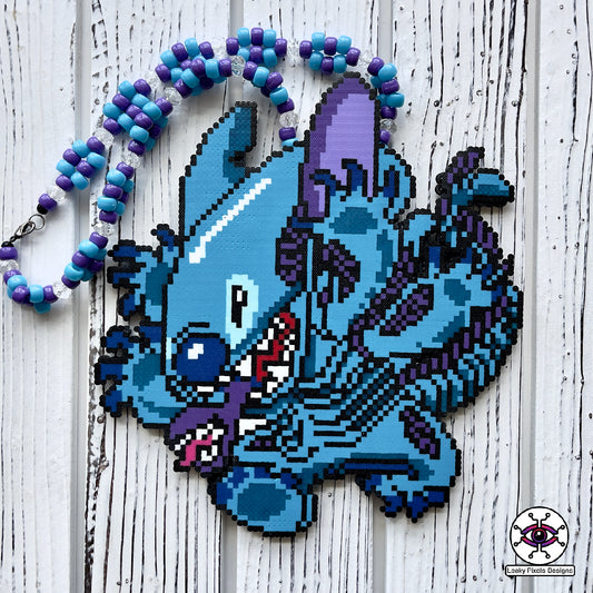 lilo and stitch perler necklace made by leaky pixels. blue and purple stitch/xenomoprh alien.