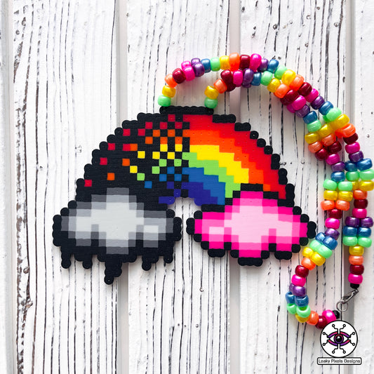 rainbow perler necklace by leaky pixels. red, orange, yellow, green, blue, purple and pink. black storm cloud and pink cloud.