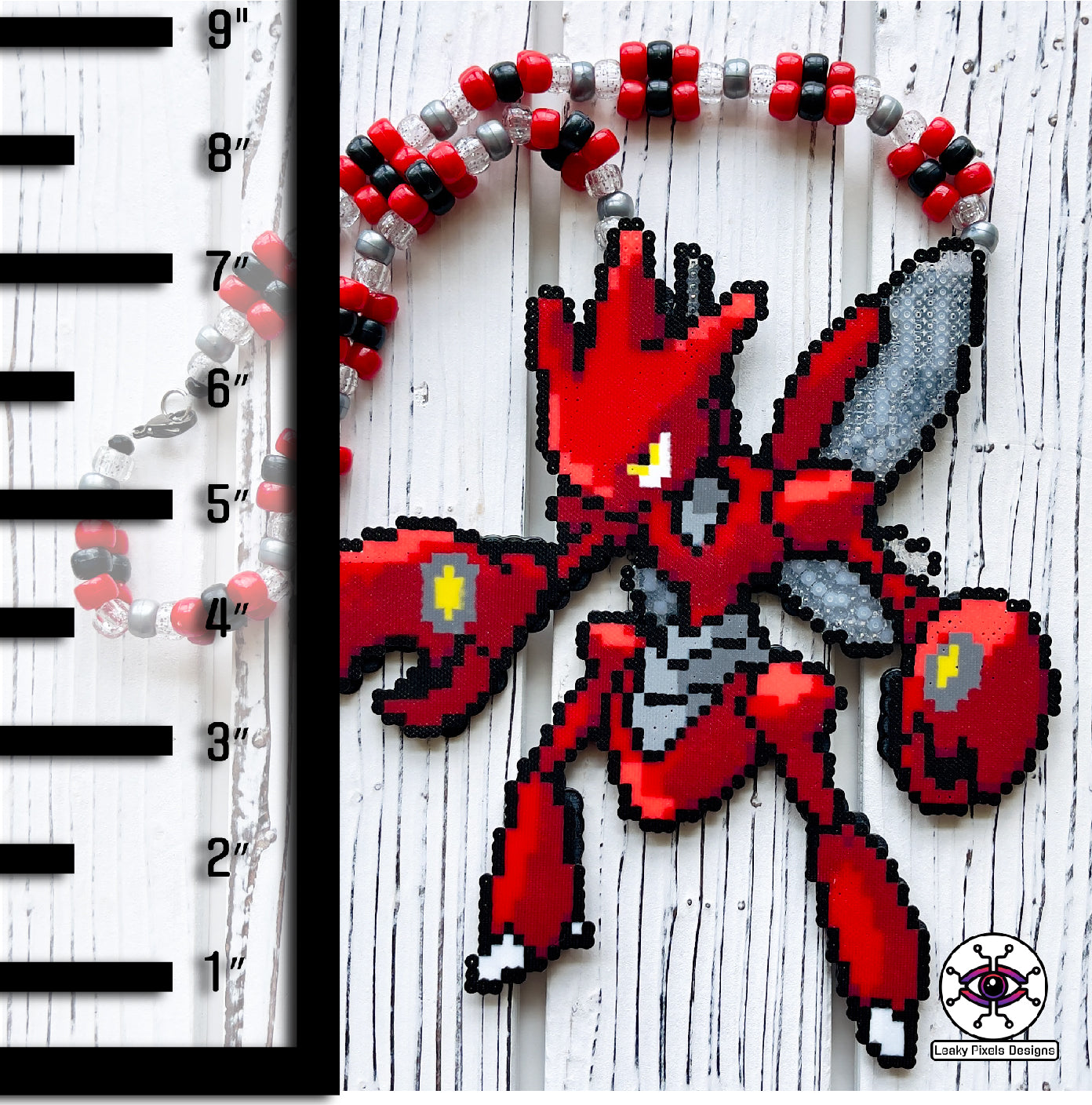 Red Scizor pokemon bug perler necklace with two wings and large pincers. Necklace is made with red, black, silver and clear glitter pony beads.