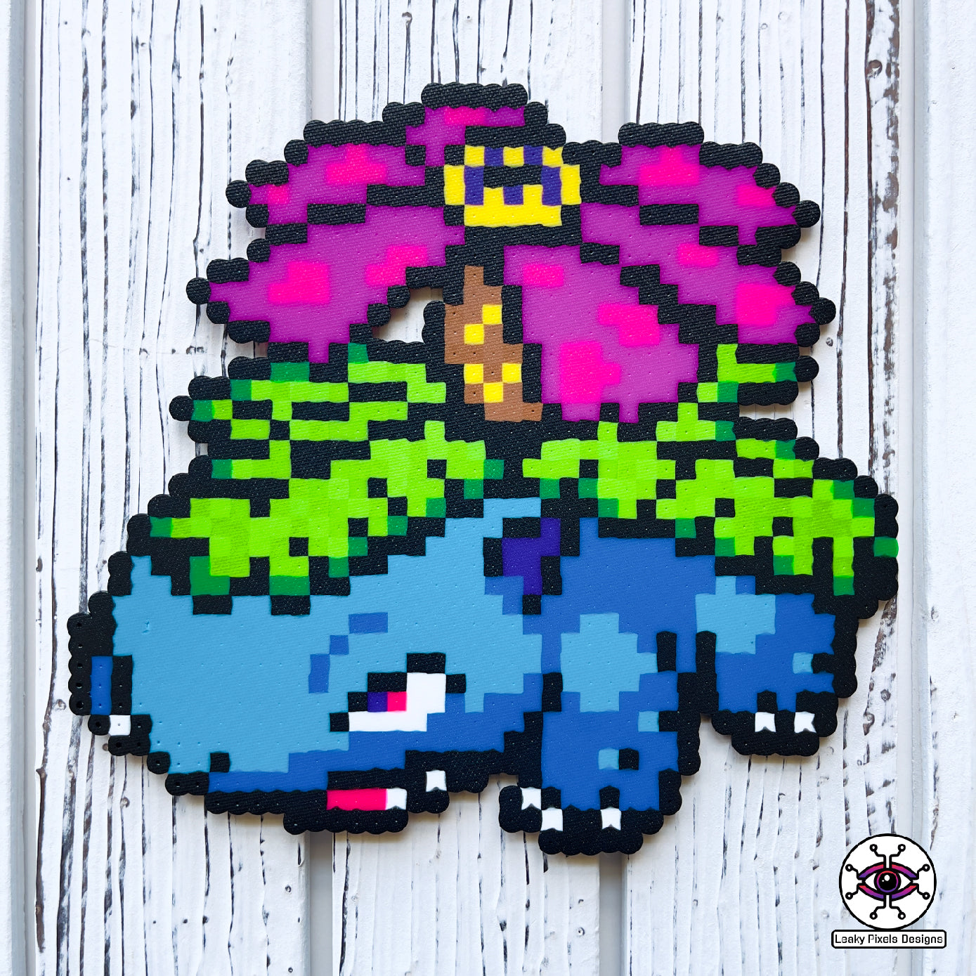 Venusaur perler necklace with rainbow flower on back pokemon. blue pokemon with a rainbow flower and green leaves. Rainbow pony beaded necklace.