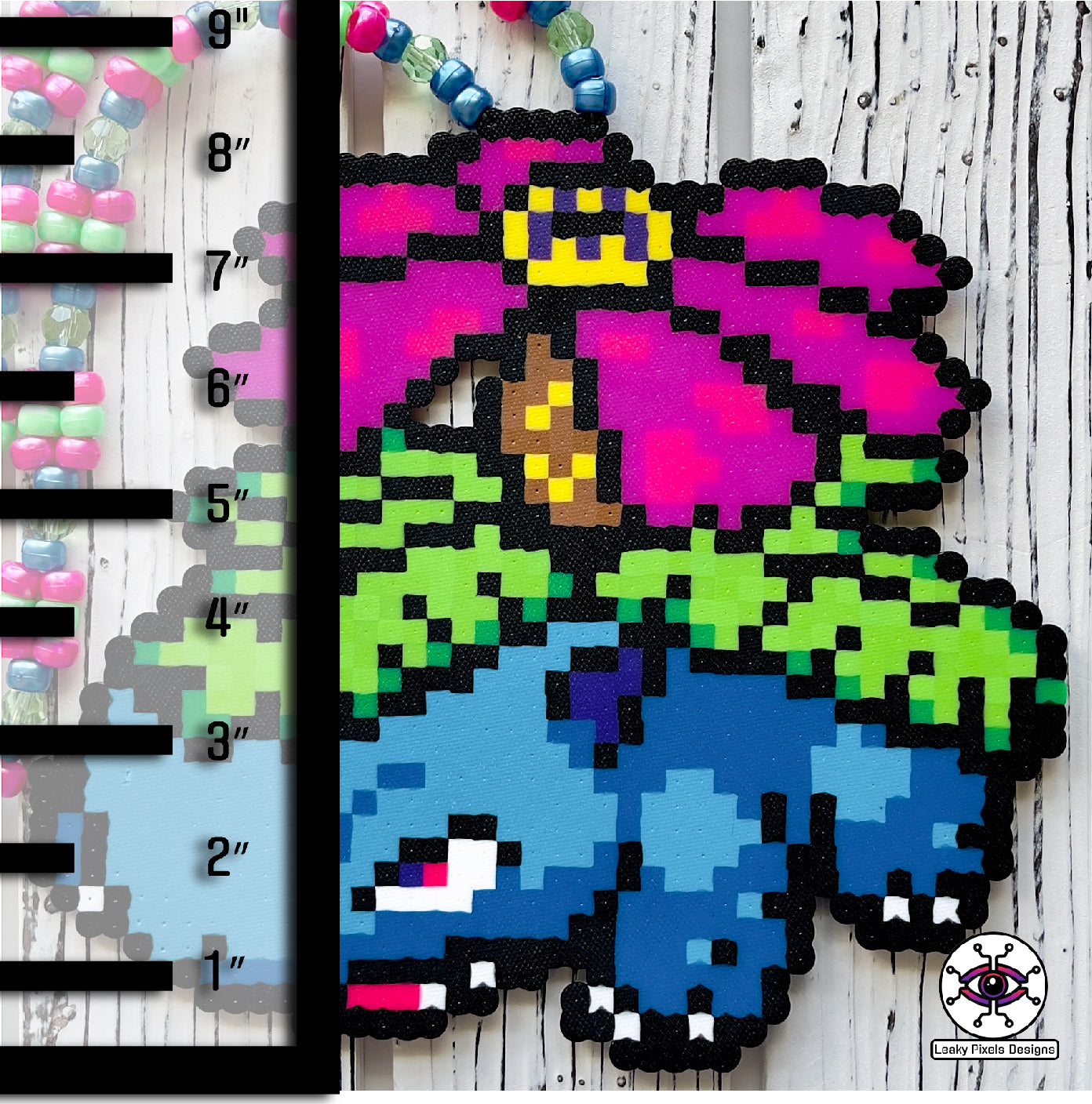 Venusaur perler necklace with rainbow flower on back pokemon. blue pokemon with a rainbow flower and green leaves. Rainbow pony beaded necklace.